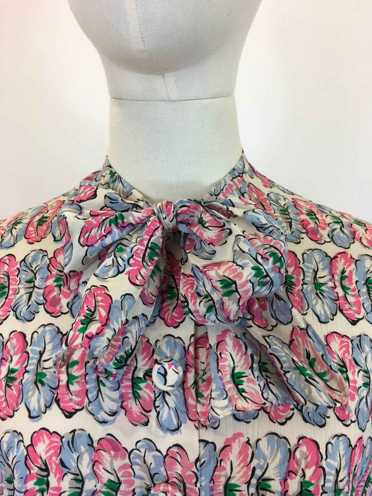 Original fabulous 1940’s long sleeved blouse - in Pink and Blue flower heads.