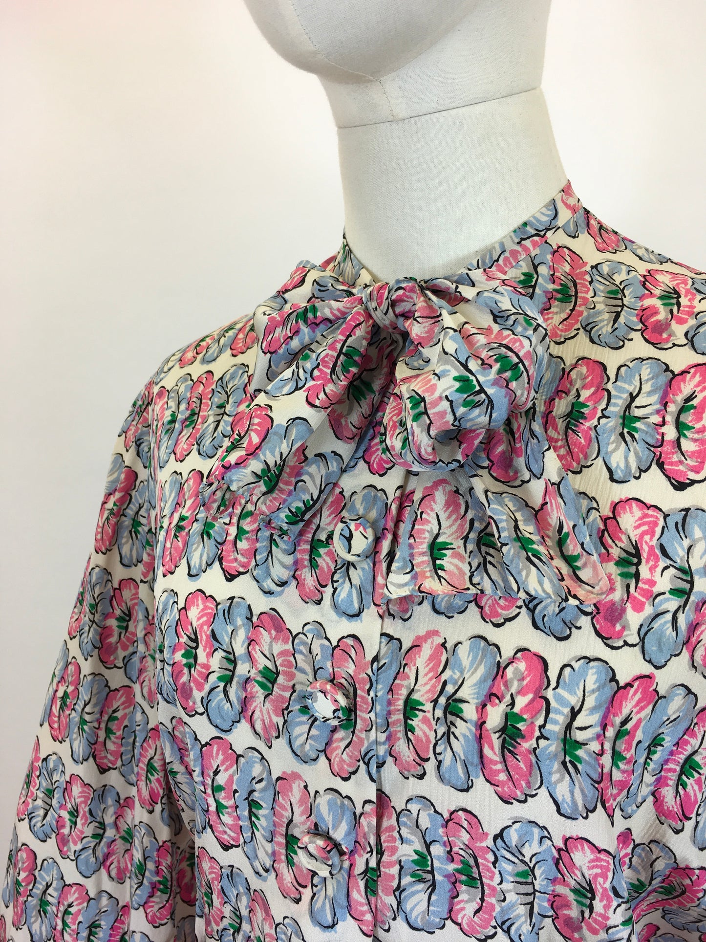 Original fabulous 1940’s long sleeved blouse - in Pink and Blue flower heads.