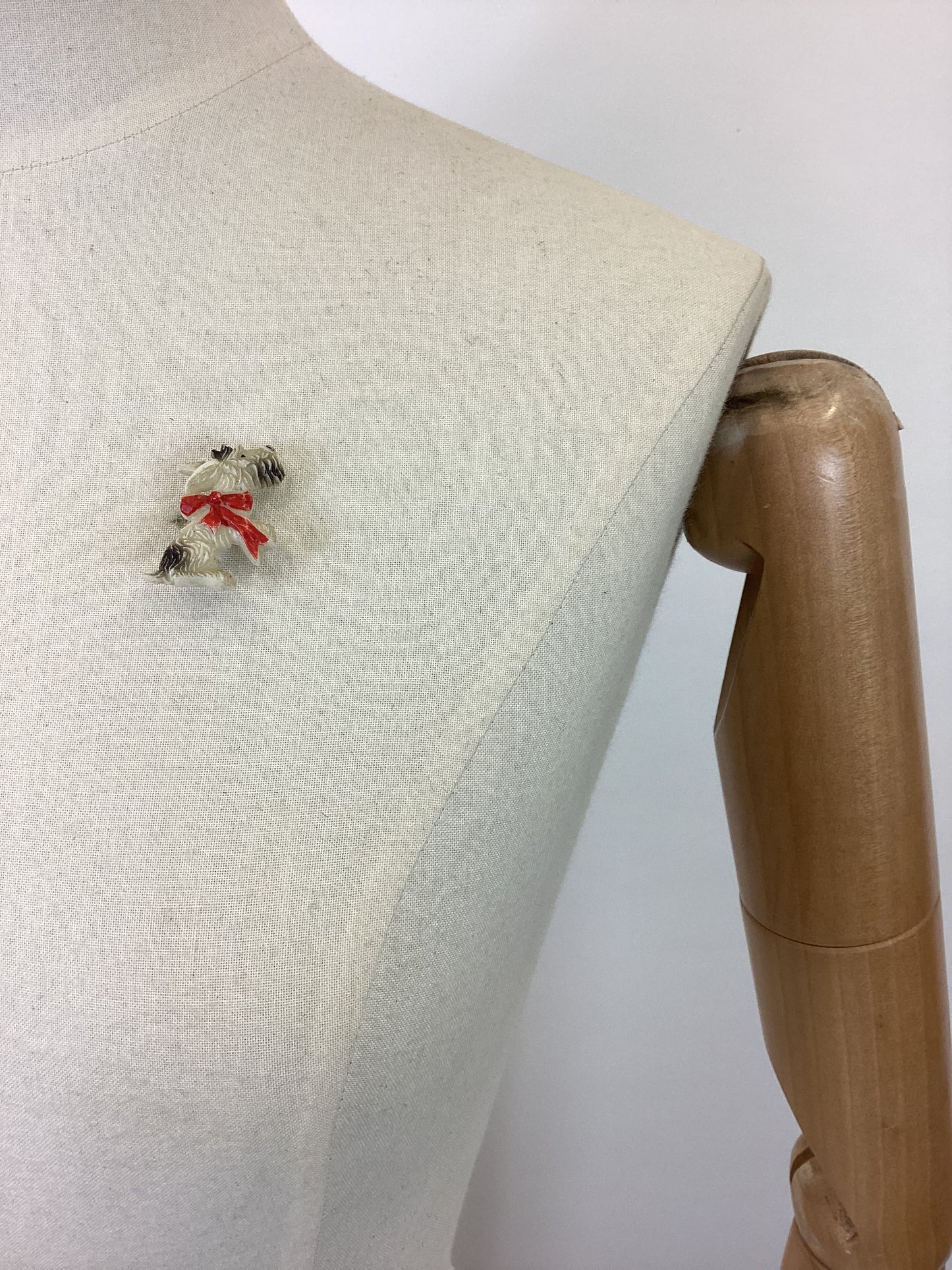 Original 40’s celluloid Brooch- sitting dog.