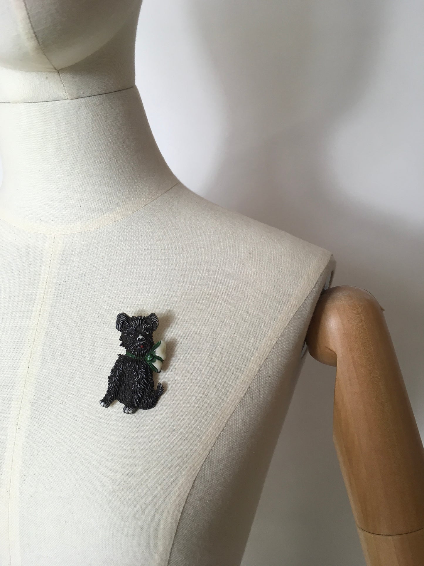 Original 1940’s Celluloid Dog Brooch - Dark Black with a Lovely Green Bow