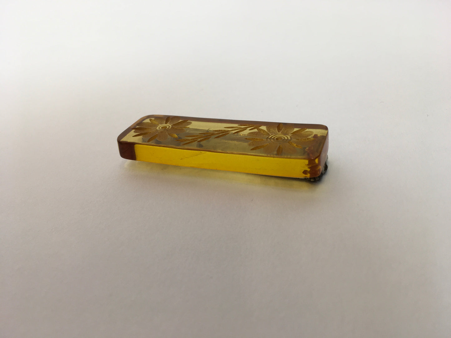 Original 1940s Carved Bakelite Dress Clip - In A Light Amber Colour way With Etched Florals