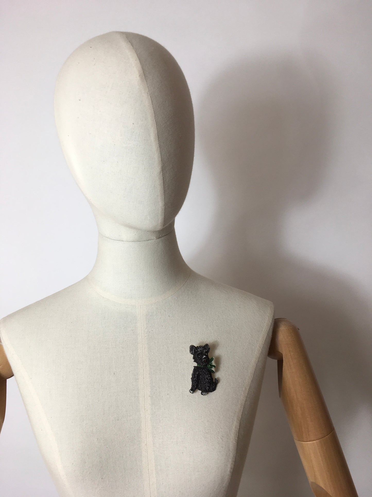 Original 1940’s Celluloid Dog Brooch - Dark Black with a Lovely Green Bow