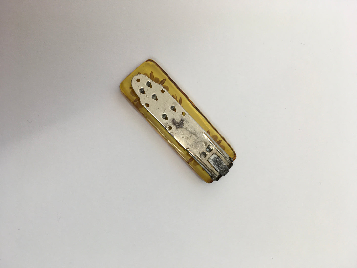 Original 1940s Carved Bakelite Dress Clip - In A Light Amber Colour way With Etched Florals