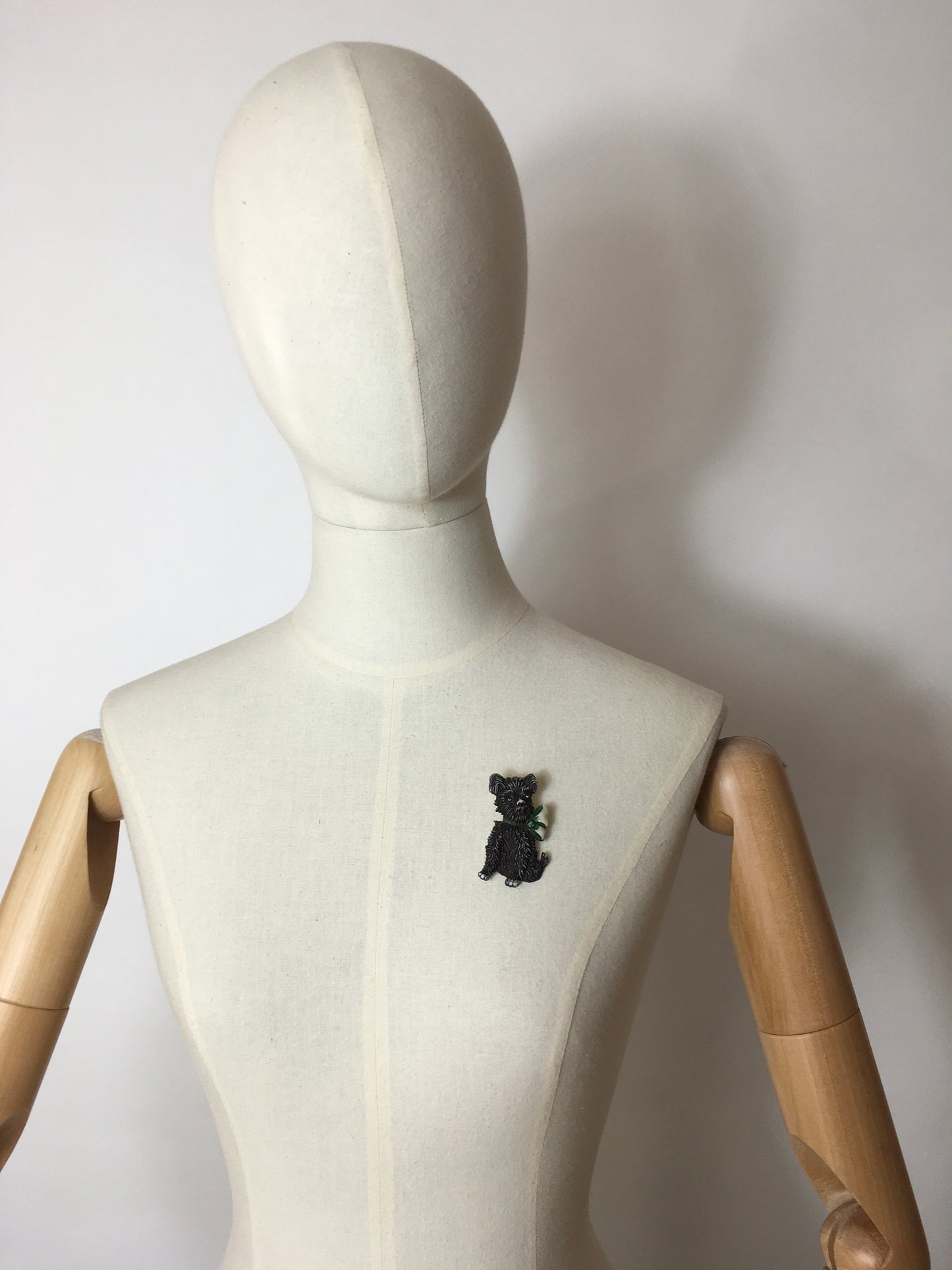 Original 1940’s Celluloid Dog Brooch - Dark Black with a Lovely Green Bow