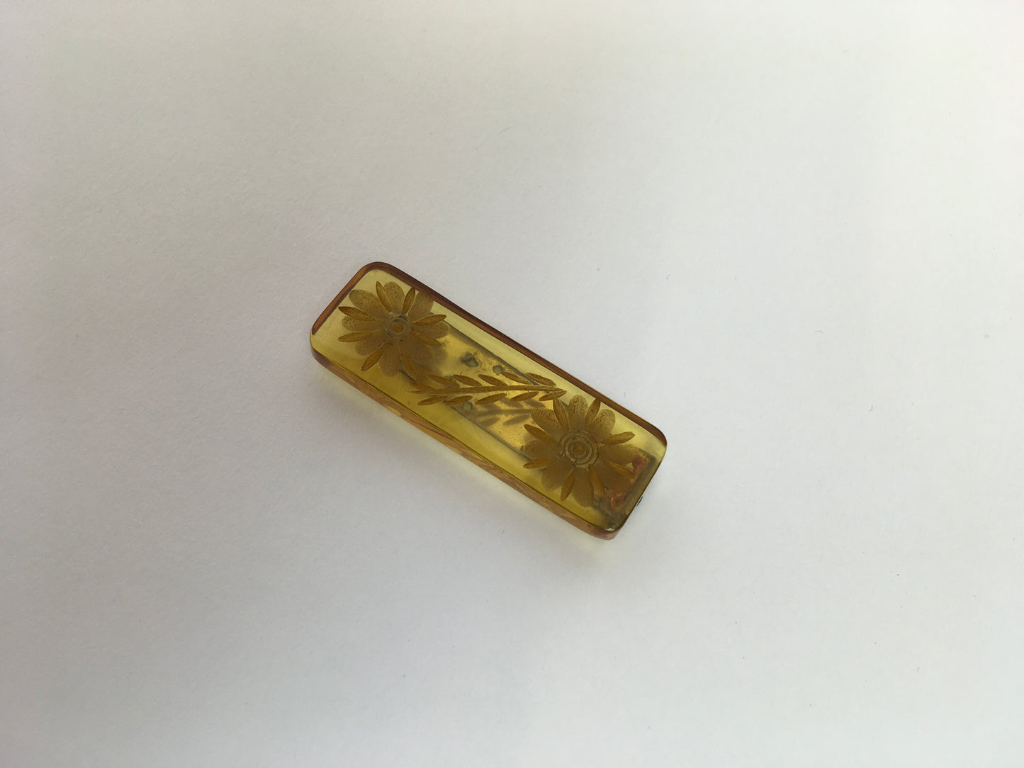 Original 1940s Carved Bakelite Dress Clip - In A Light Amber Colour way With Etched Florals