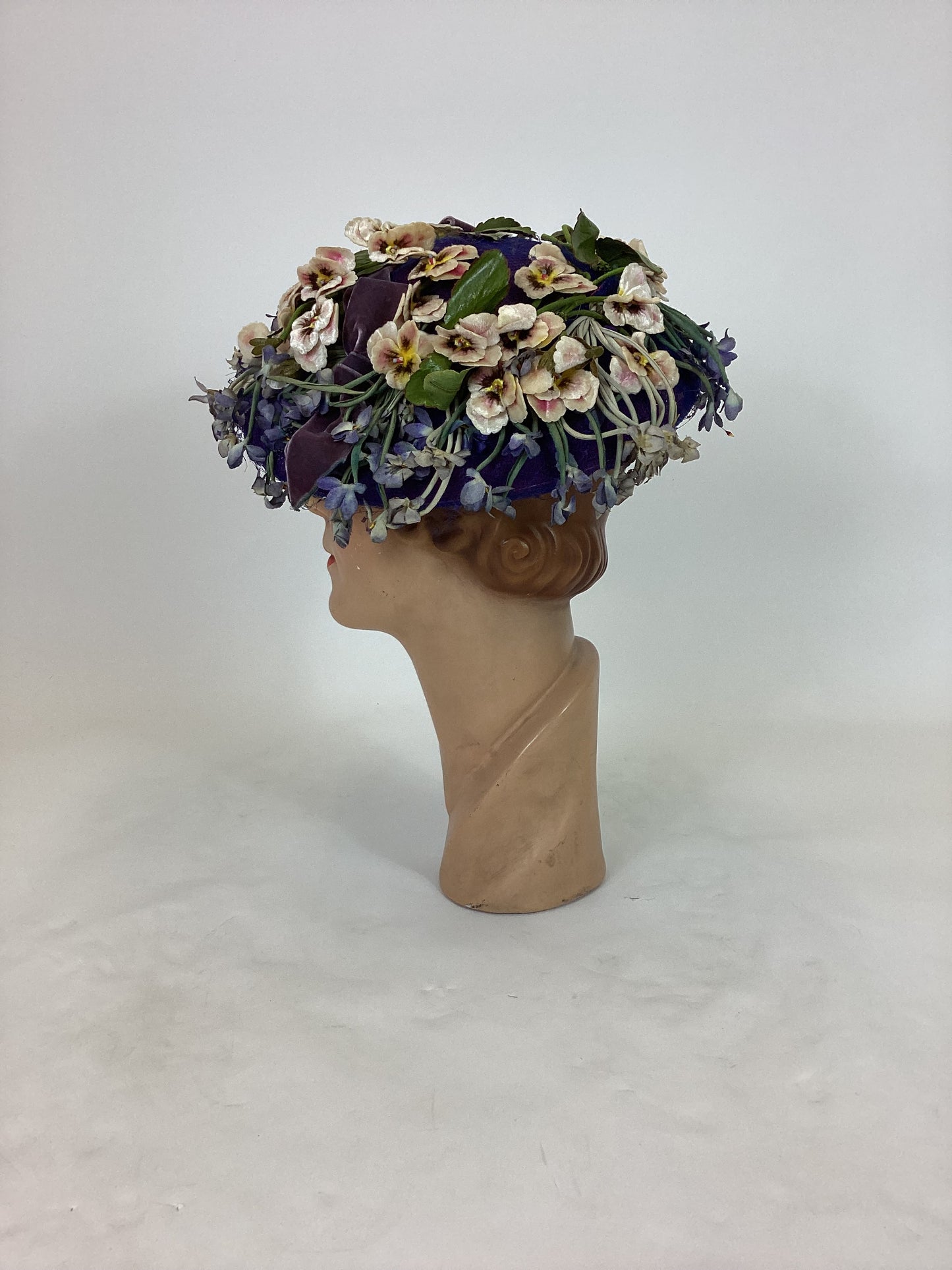 Original 1940’s Striking Platter Hat - A true Cadbury Purple, adorned with mixed flowers.