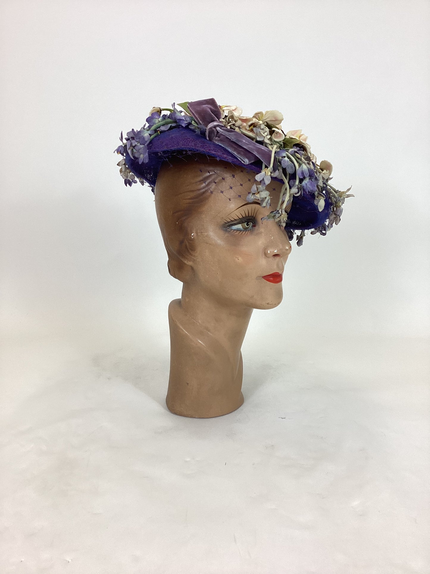 Original 1940’s Striking Platter Hat - A true Cadbury Purple, adorned with mixed flowers.