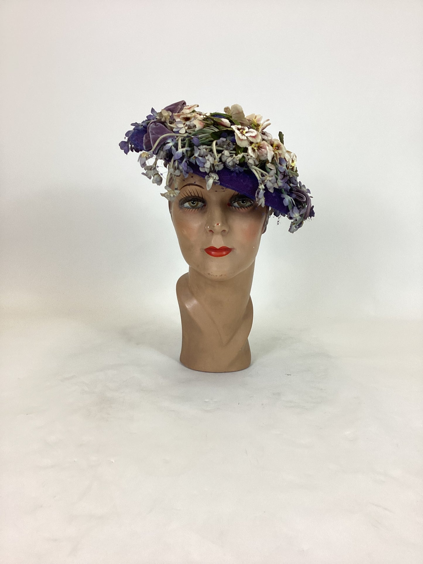 Original 1940’s Striking Platter Hat - A true Cadbury Purple, adorned with mixed flowers.