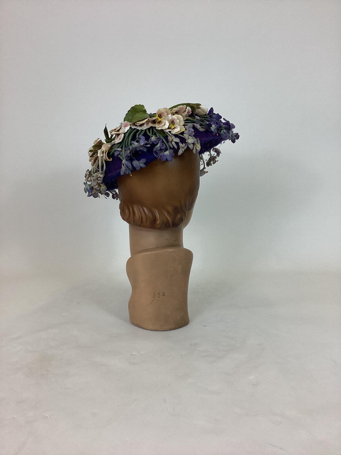 Original 1940’s Striking Platter Hat - A true Cadbury Purple, adorned with mixed flowers.