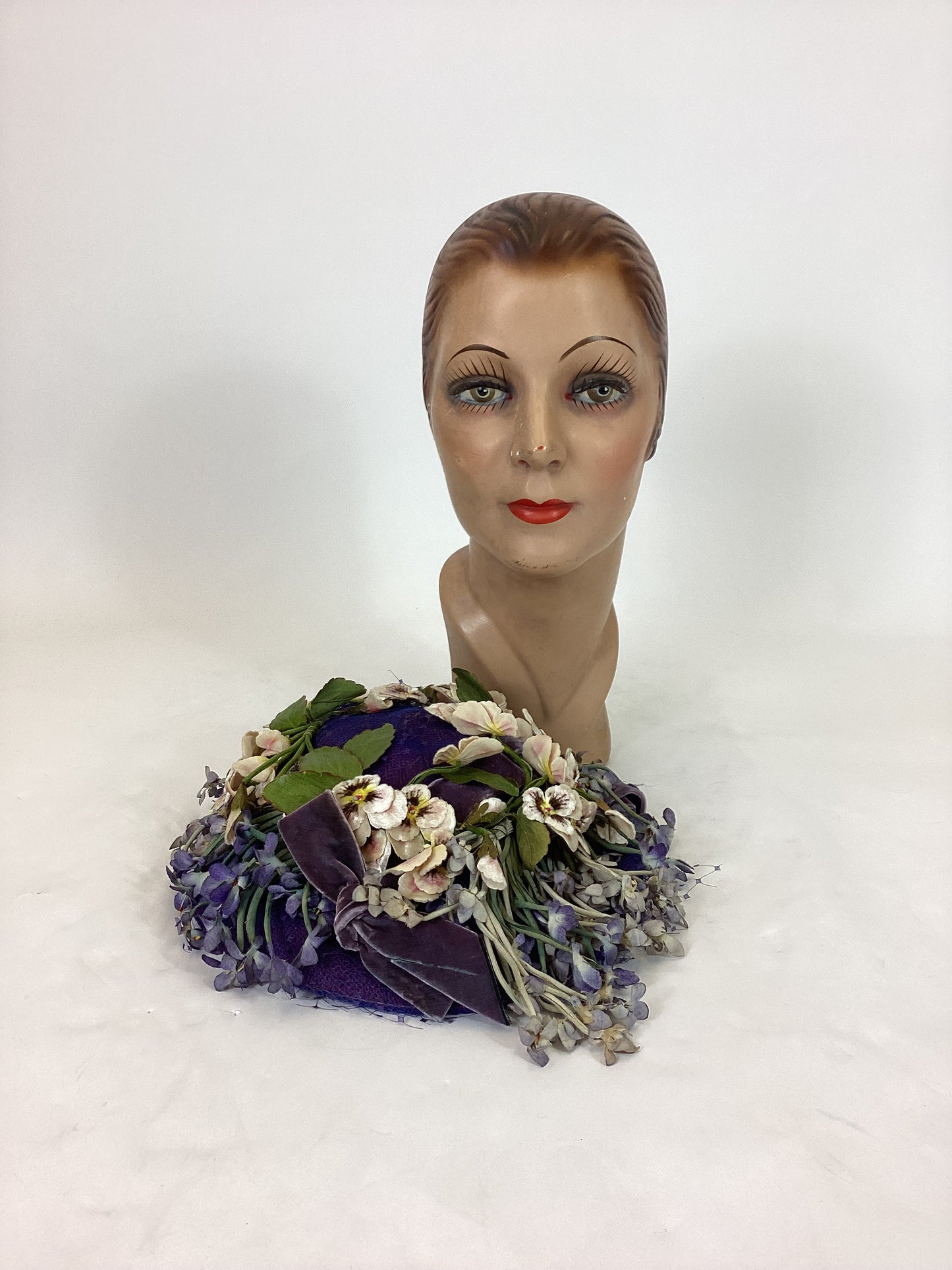 Original 1940’s Striking Platter Hat - A true Cadbury Purple, adorned with mixed flowers.