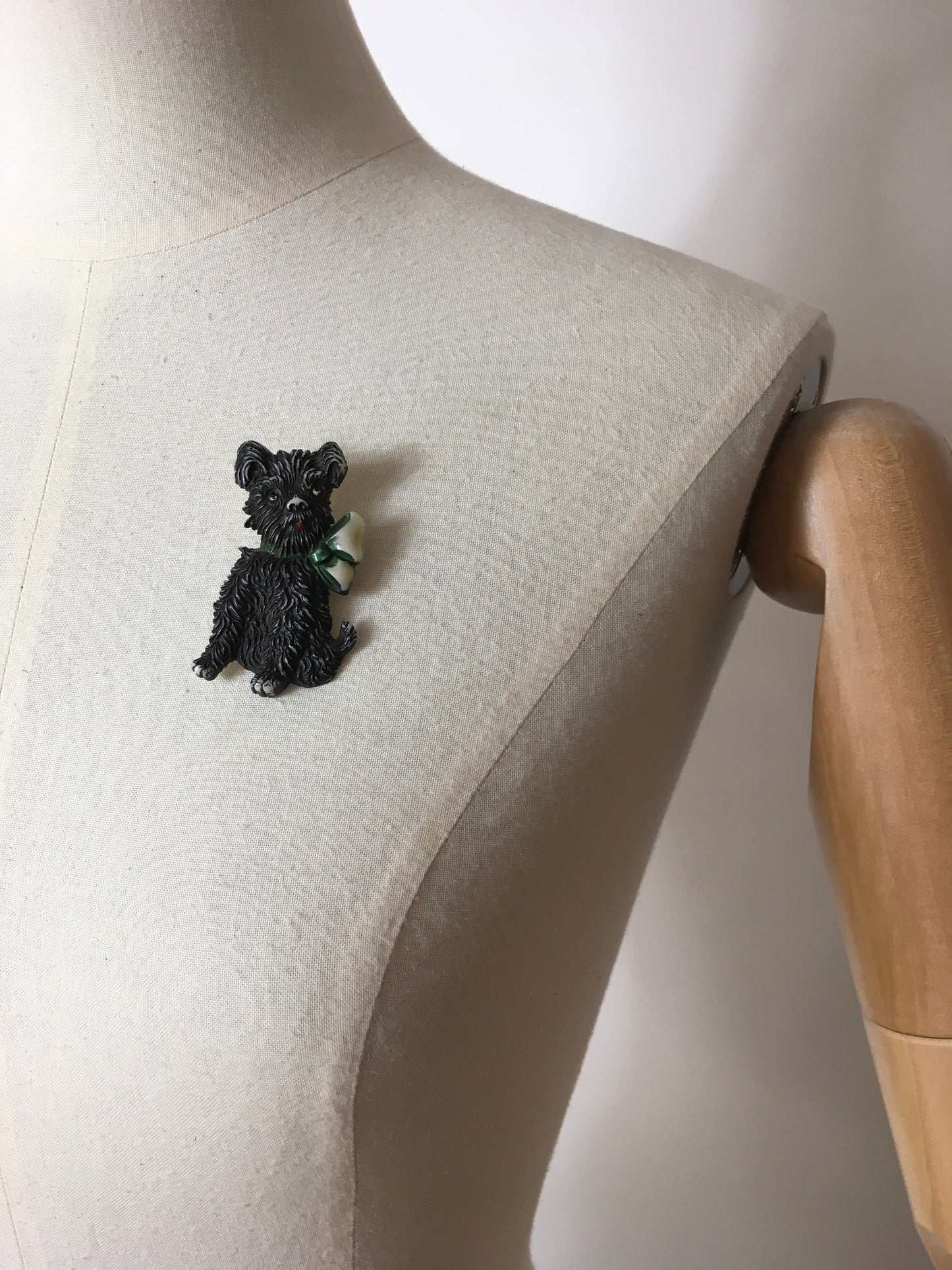Original 1940’s Celluloid Dog Brooch - Dark Black with a Lovely Green Bow