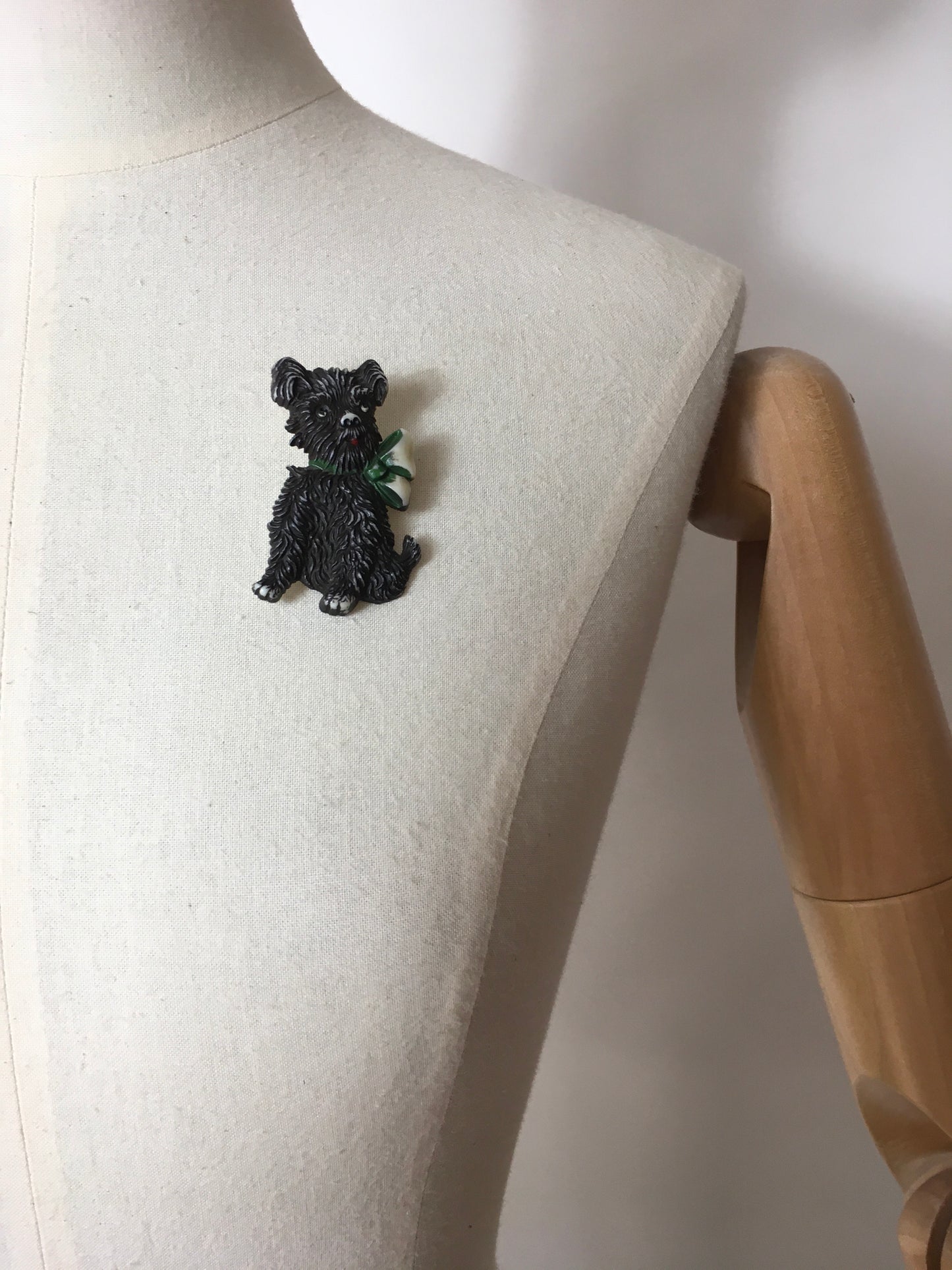 Original 1940’s Celluloid Dog Brooch - Dark Black with a Lovely Green Bow